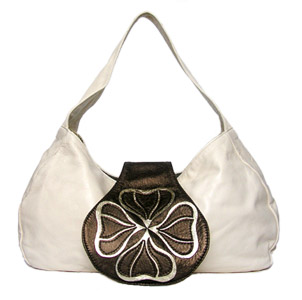 This beautiful soft leather bag detailed with a bold Lilly motif, has been designed to be both practical and stylish. Each bag is lined with gold woven William Morris inspired, printed silk for that added touch of luxury. Features two mobile phone pockets at either end for your convenience and a wide base and contoured shoulder strap for comfort. Making this bag an absolute must have for any occasion.To view the full collection go to www.wear-me.co.uk